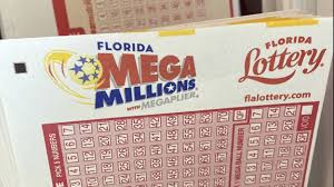 Close-up of a Florida Mega Millions lottery ticket, featuring selection boxes and the iconic logos of the Florida Lottery and Mega Millions, against a stark white background, with the official Florida Lottery website link prominently displayed.