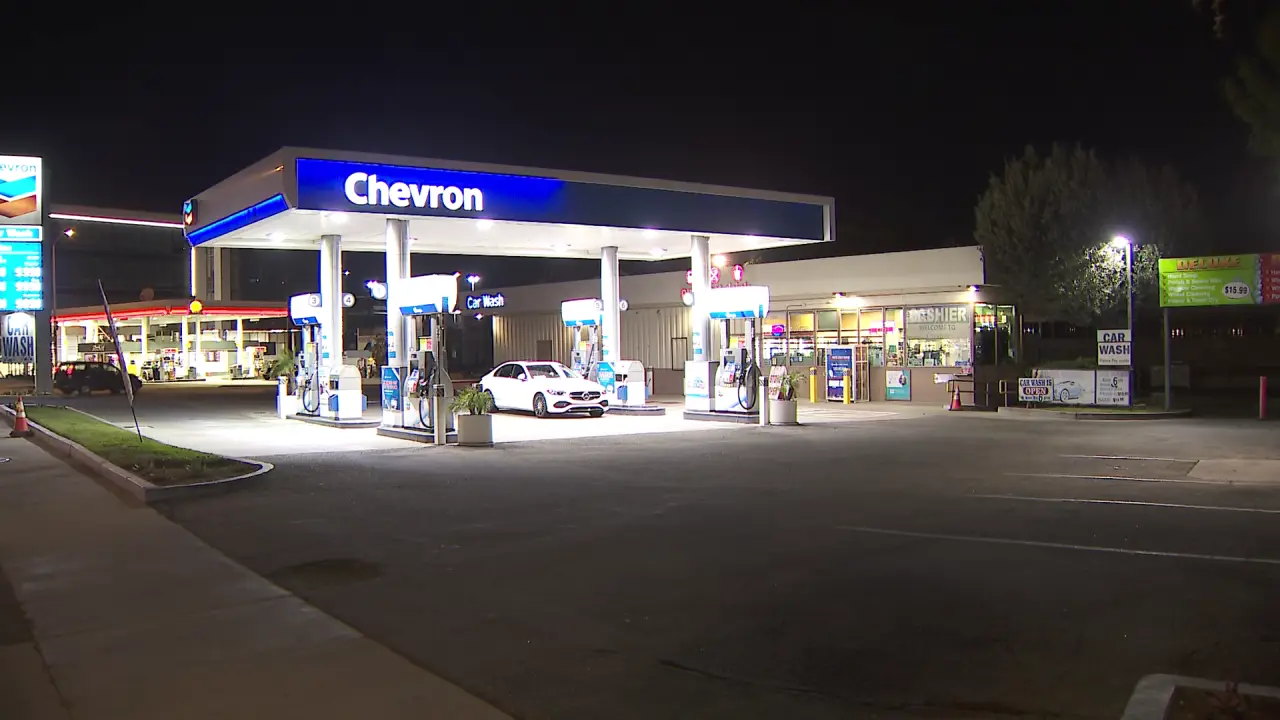 Chevron gas station at night where lottery tickets are often sold alongside fuel and convenience items.